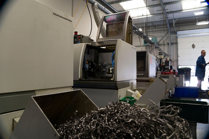 Precision Engineering Machine with Operator In Background